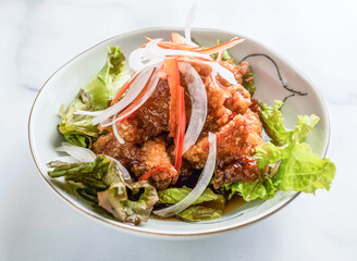 Delicious salad with crispy fried chicken and fresh vegetables