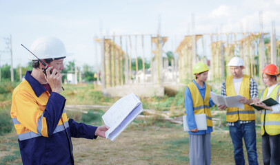 Male and female engineers who are Asian professionals in the construction industry focus on village design and architecture to create sustainable houses for people to rent and sell.
