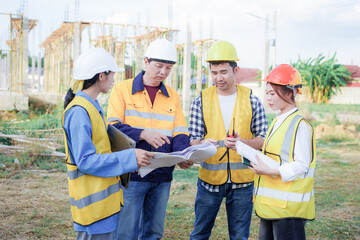 Male and female engineers who are Asian professionals in the construction industry focus on village design and architecture to create sustainable houses for people to rent and sell.