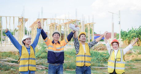 Male and female engineers who are Asian professionals in the construction industry focus on village design and architecture to create sustainable houses for people to rent and sell.