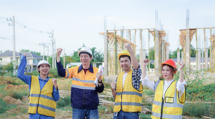 Male and female engineers who are Asian professionals in the construction industry focus on village design and architecture to create sustainable houses for people to rent and sell.