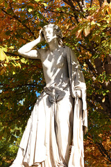 Stone statue in Paseo de Recoletos in Madrid city