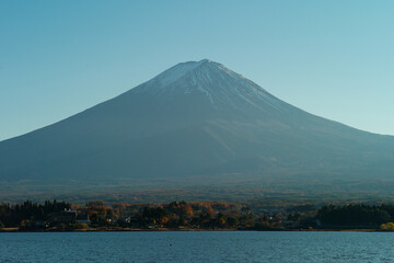 Fototapeta premium Panorama view of Fuji mountain isolated on the blue sky with lake in foreground
