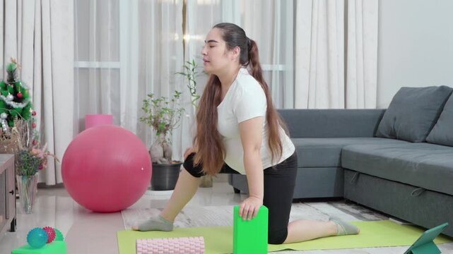 Pregnant woman, stretching and exercise on floor in home for pelvic strength, maternity fitness and improve flexibility. Girl, living room and prenatal yoga for circulation, back pain and posture. 