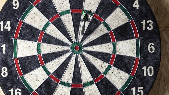 dart on target, playing a game of darts 
