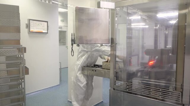 Automated ampoule filling and sealing conveyor line in pharmaceutical production facility