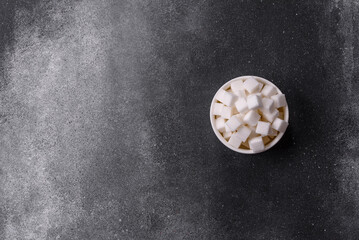 Sweet white sugar cubes as a source of glucose. White sugar cubes as a food background
