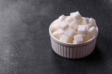 Sweet white sugar cubes as a source of glucose. White sugar cubes as a food background