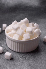 Sweet white sugar cubes as a source of glucose. White sugar cubes as a food background