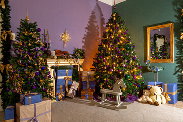 decorated Christmas tree in the corner of the room with gifts and a mirror