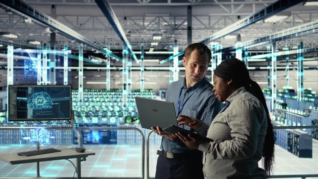 Engineering team in data center uses AR simulation to visualize AI systems, VFX compositing concept. Teamworking server farm colleagues oversee deep learning equipment using digital twin visualization