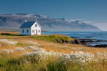 White church overlooking the coast in iceland fjord