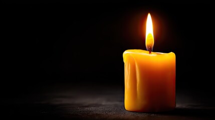 Warm candle light flickers in dark space with soft shadows