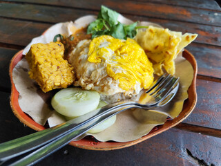 Nasi pecel or sego pecel is a typical Javanese Indonesian rice dish served with pecel sauce,...