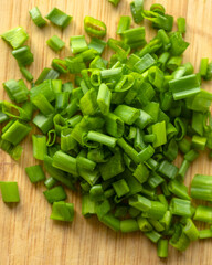 Sliced Fresh Green Onion on Wooden Cutting Board