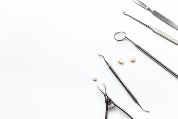 Dental equipment tools for teeth care on white background. Professional Dentist desktop, top view