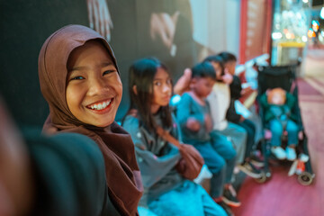 A lively group of children joyfully enjoying their time outdoors with friends