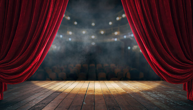 Stage set for a performance with red curtains drawn back and spotlight shining on the wooden floor in a theater