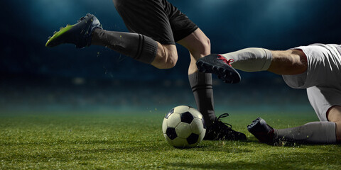Football boots and ball interaction during close range duel. Concept of soccer boot detail, confident control, professional equipment performance, gear promo, technical precision.