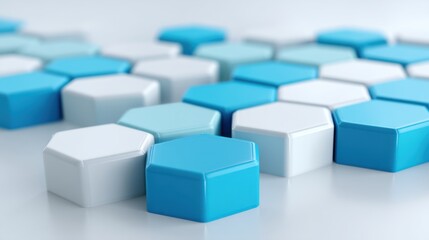 Obraz premium Abstract arrangement of hexagonal tiles in shades of blue and white on a smooth surface exhibiting modern design elements and geometric patterns