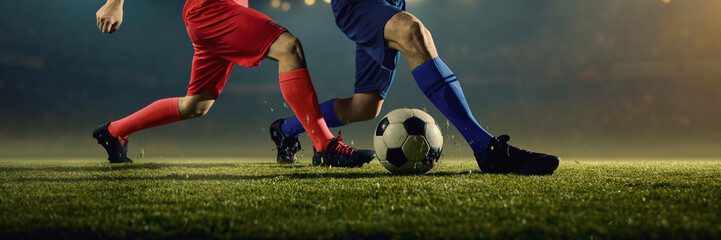 Explosive football players movements near ball. Concept of dynamic movement, sharp agility, blurred...