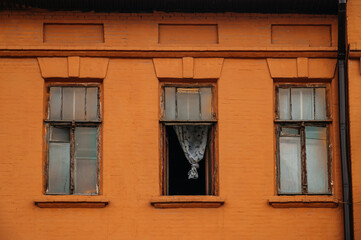 old windows in an old orange building
