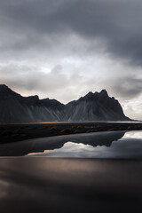 Vestrahorn on the peninsula Stokksnes on iceland reflected in the hub od a car
