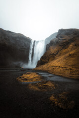 Sk&oacute;gafoss - waterfall in iceland in moody wetaher conditions