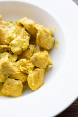 Close-Up of Curry Chicken on a White Plate
