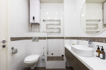 modern bathroom room with toilet and washing machine