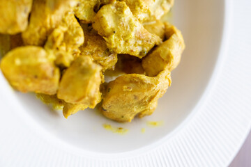 Close-Up of Curry Chicken on a White Plate
