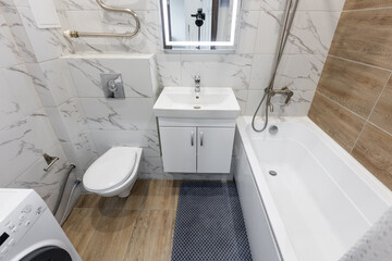 modern bathroom room with toilet and washing machine