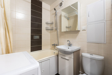 modern bathroom room with toilet and washing machine