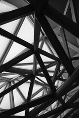 Geometric architecture patterns with overlapping steel beams and glass panels