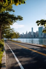 Scenic riverside road with skyline view on clear day