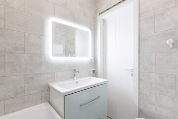 modern bathroom room with toilet and washing machine