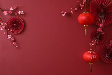 Obraz premium Red wall decor with paper fans, lanterns, and cherry blossoms for a festive celebration or event