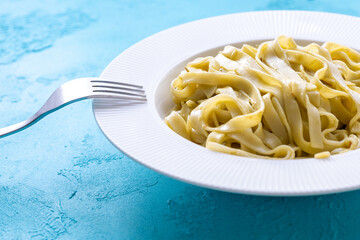 Close-Up of Creamy Pesto Tagliatelle Pasta
