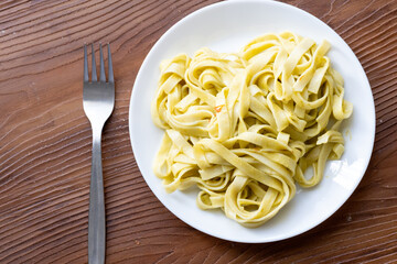 Close-Up of Creamy Pesto Tagliatelle Pasta
