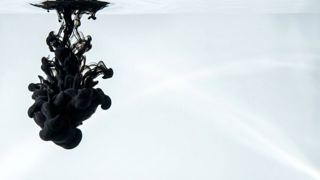 Black ink cloud blooming in clear water, minimalist abstract concept