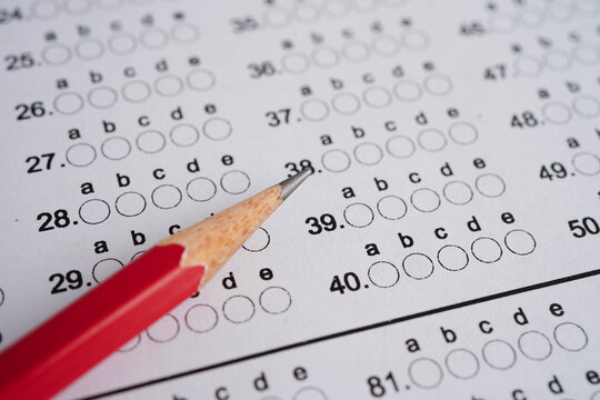 Answer sheets with pencil drawing fill to select choice, education concept.