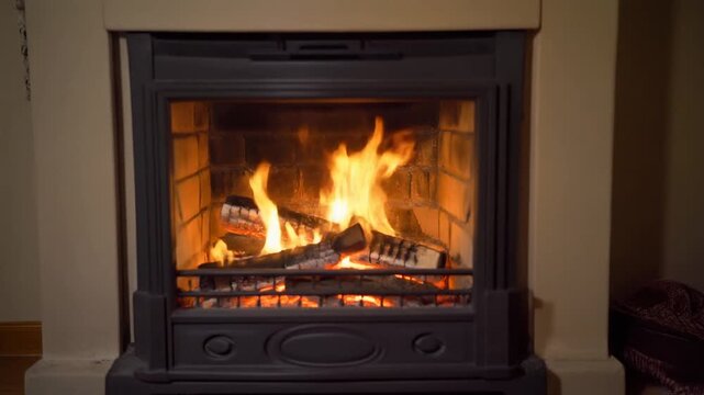 Traditional Black Fireplace Insert with Roaring Wood Fire and Flames