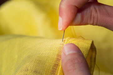 Close Up Hand Stitching Hemstitch On Yellow Linen