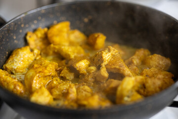 Close-Up of Curry Chicken on a White Plate
