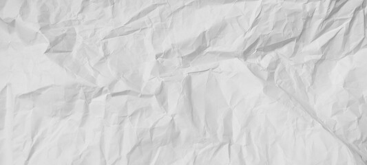 Fototapeta premium Old crumpled white paper background for creative projects. Recycled craft paper texture with empty space for text or layout.