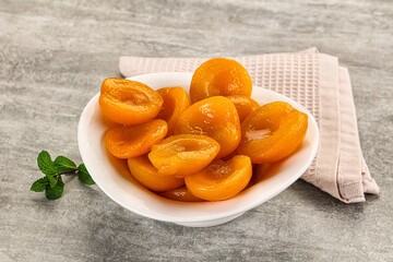 Sweet canned apricots with syrope