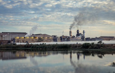 Fototapeta premium Smoke from industrial chimneys. Climate change, toxic smoke affects the environment.