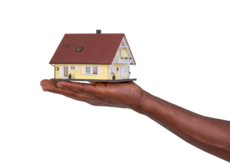 Hand holding a small model of a house isolated on white or transparent background	
