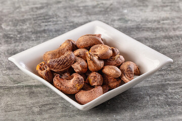 Unpeeled cashew nuts in the bowl