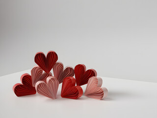 A cluster of red and pink hearts on a white surface
